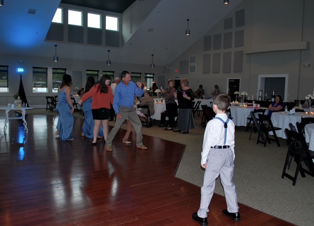 Event goers dancing at the wedding