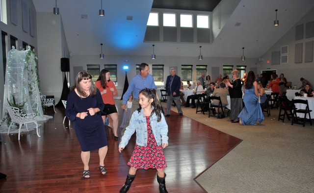Event goers dancing at the wedding