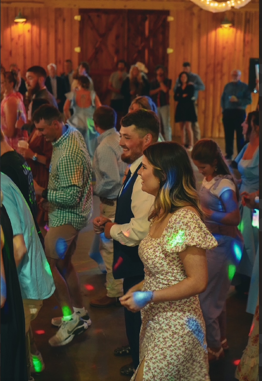 Guests dancing at an outdoor wedding