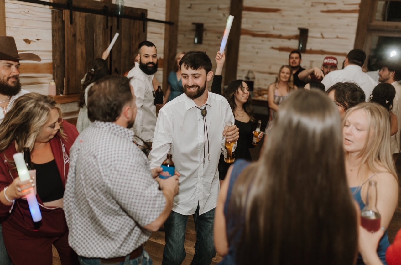 Event goers dancing at the wedding